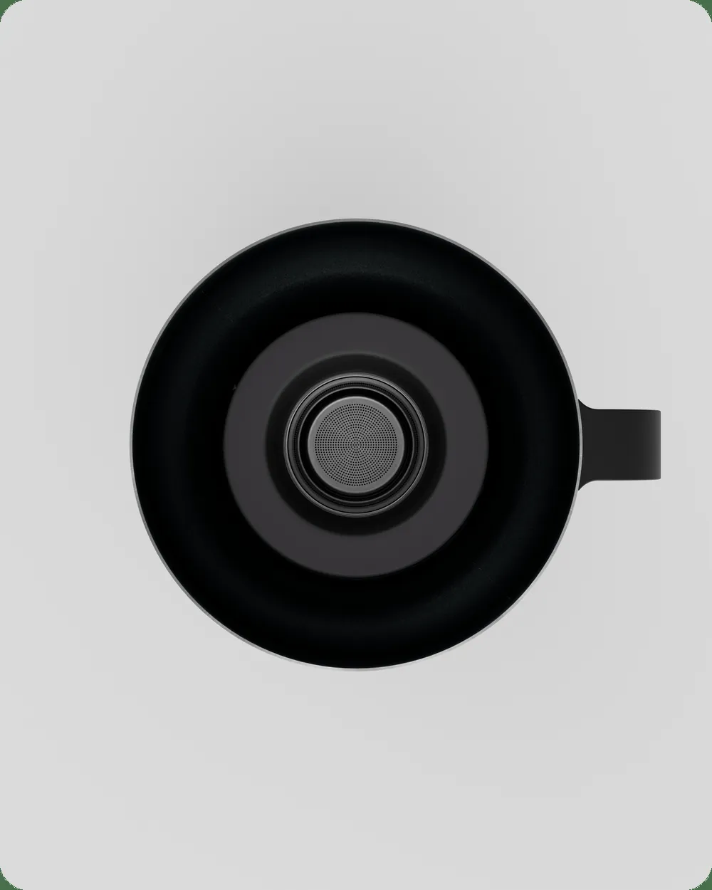The Chai Maker seen from above, with its round rim and handle