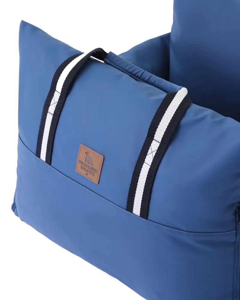 The side pocket and striped carry handle of the Dog Dock